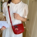 Mini red leather crossbody bag with checkered floral pendant for a casual summer style - Red with Pendant