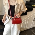 Red glossy crossbody bag with silver rivets and dual-handle design for chic daily wear - Red