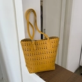 Yellow hollow out tote bag in synthetic leather with laser-cut patterns and wavy edges - Yellow