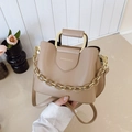 Elegant beige bucket bag with gold metal handle and fashion lettering detail - Khaki