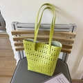 Vibrant bright green laser-cut hollow tote bag with wavy edges and matching straps - Green