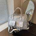 Matte silver woven travel bag with cross-weave texture and adjustable strap - Silver