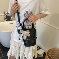 Fashionable black hollowed-out bucket bag with light blue drawstring and floral pendant - Black