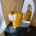 Yellow hollow out bucket tote bag with white flower charm and smooth leather trim - Yellow