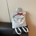 Chic backpack in white fabric with red bow print and large bow charm on black book - Blue