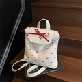 White PU leather backpack with red bow patterns and a large silk bow accent - Off White