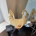 Pale yellow crescent-shaped leather shoulder bag with star and balloon dog charms - Yellow with Pendant