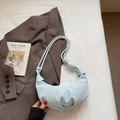 Light blue crescent handbag with pleated texture and decorative knotted shoulder strap - Blue Without Charm