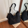 Black nylon crossbody tote bag with adjustable wide strap and matching mini pouch - Black