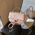 Quilted light pink mini crossbody bag with silver chain handle and rhombic pattern - Pink