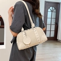 Chic beige lychee leather underarm pillow bag with silver rivet details and strap - Off White