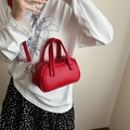 Chic red mini Boston handbag in litchi grain synthetic leather with top handles - Red