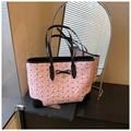 Pink tote bag detail with black bows, patent leather trim and golden heart pendant - Pink