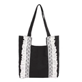 Large black canvas tote bag for women featuring white lace ruffles and double handles - Black