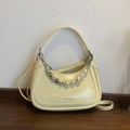 Cream yellow shoulder bag with silver heart charms and decorative pearl chain - Yellow