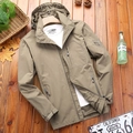 Men's khaki hooded waterproof jacket with chest zipper pockets on wood background - XL / Khaki