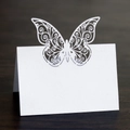 Laser-cut butterfly place cards in white, perfect for wedding seating and table arrangements - White