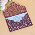 Detailed laser cut burgundy wedding invitation card with intricate scrollwork patterns - Dark Red