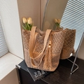 Bohemian woven straw tote bag featuring tassels and wooden beads for beach vacations - Khaki