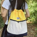 Three-color patchwork drawstring backpack in yellow and beige nylon with black front pocket - Yellow & White
