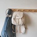 Fashionable cream white drawstring backpack for women with minimalist patch detail - White (Small)