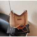 Detailed knit texture and brown leather strap of a khaki striped summer beach bag - Khaki