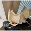 Detail showing cream woven texture and logo on the minimalist knitted shoulder bag - Off-white