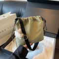 Mini bean green drawstring bucket bag with shoulder strap and plush charm - Green with Pendant