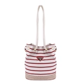 Red and white striped canvas bucket bag with thick white rope handles and woven base - Red