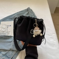 Mini black drawstring bucket bag made of nylon with a cute monster plush charm and strap - Black with Pendant