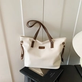 Minimalist cream white leather tote bag with dark brown contrast straps and trim - White