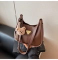 Detail of dark brown crescent hobo bag with gold logo and plush bear charm decoration - With Charm / Brown