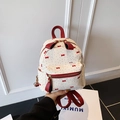 Mini white quilted backpack with red bow print and vibrant red straps for women - White