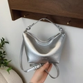 Sleek silver metallic dumpling bag with adjustable shoulder strap and logo detail - Silver