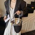 Silver metallic dumpling bag with thin straps and a brown charm for women fashion - With Pendant / Silver