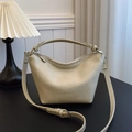 Chic cream dumpling bag in vegan leather with adjustable strap and embossed detail - Off White