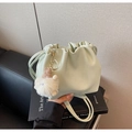 Detail of mint green drawstring bucket bag with cute plush sheep pendant on books - Light Green With Charm