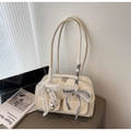 Creamy patent leather tote bag with lace bow and metal heart charms in a minimalist setting - Cream White With Pendant