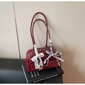 Deep red patent leather shoulder bag with decorative lace bows and heart charm detail - Red with Pendant