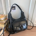 Detail of black faux leather dumpling bag with silver buckle and pleated texture - Black