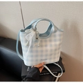 Detailed view of checkered tote bag with pearl bow charm and brand logo on book - Blue with Charm