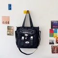 Sac fourre-tout polyvalent en toile noire avec rabat et boucles blanches pour l'école - Noir