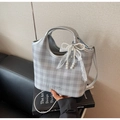 Detail of silver checkered tote bag featuring a pearl lace bow charm on a book - Silver (With Pendant)