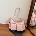 Glossy pink multi-pocket crossbody bag with shiny finish and silver metal zippers - Pink