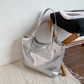 Metallic silver tote bag with slim shoulder straps and sleek minimalist finish - With Charm / Silver