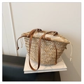 Detail of straw woven tote bag with brown leather straps and white canvas drawstring liner - Solid Color