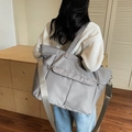 Minimalist grey large capacity nylon tote bag with adjustable shoulder strap and NOCO logo - Gray