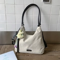 Beige canvas crescent tote bag with black straps and yellow moon plush pendant - Black with Pendant