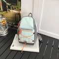 Light mint green and grey outdoor backpack featuring orange bungee cords and side mesh pockets - Small / Green