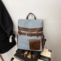 Zaino retrò in denim azzurro con accenti in pelle marrone e dettaglio fibbia elegante - Blu